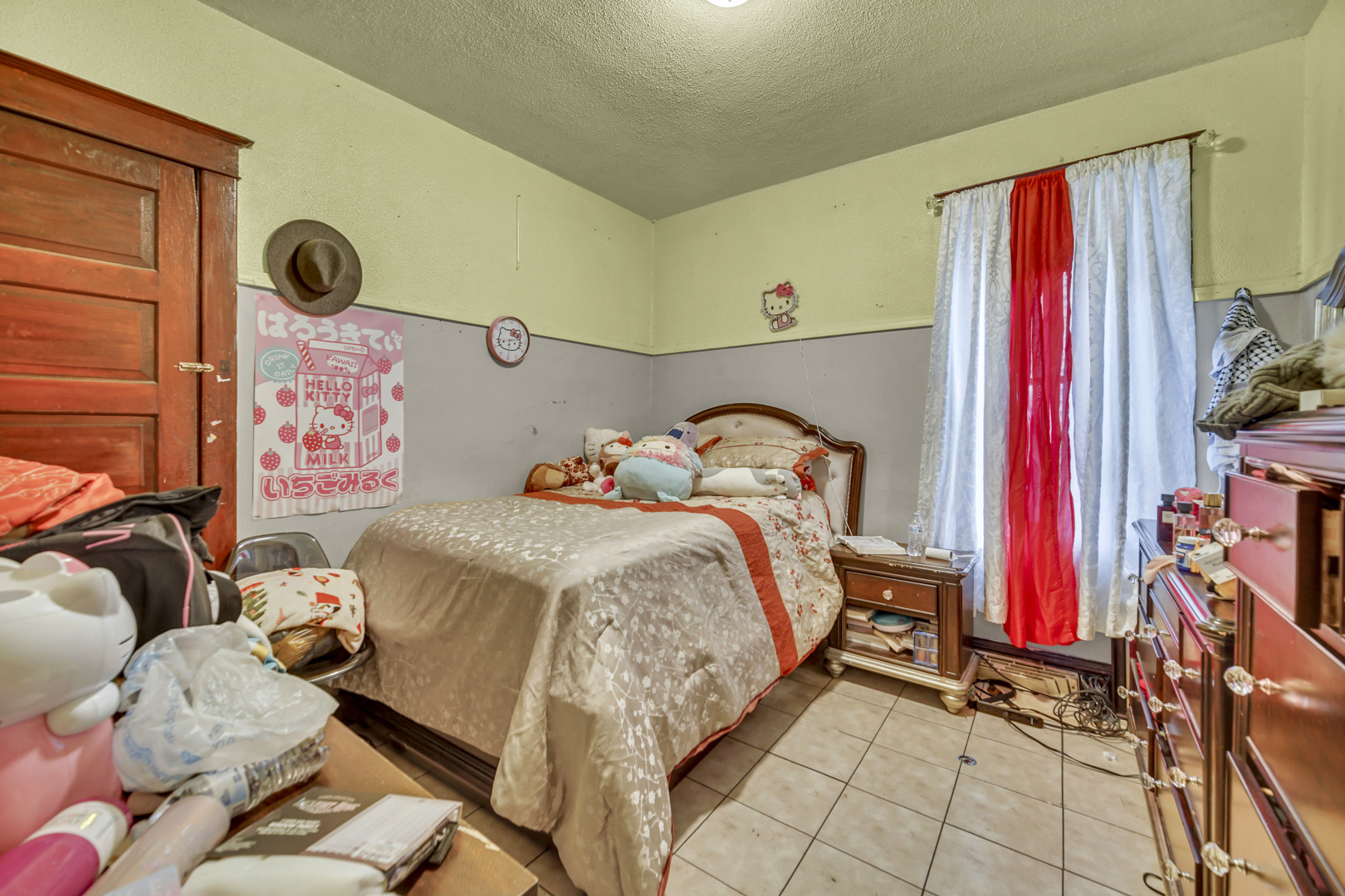 720 Meeker Avenue Joliet, IL 60432 - Photo 9 of 20 a bedroom with a bed and a window