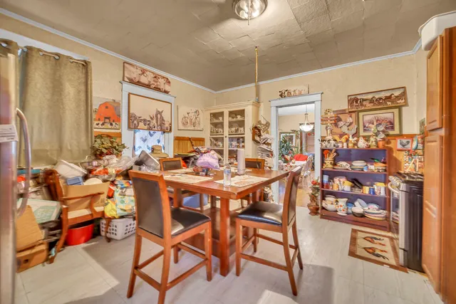 a view of a dining room with furniture and chandelier