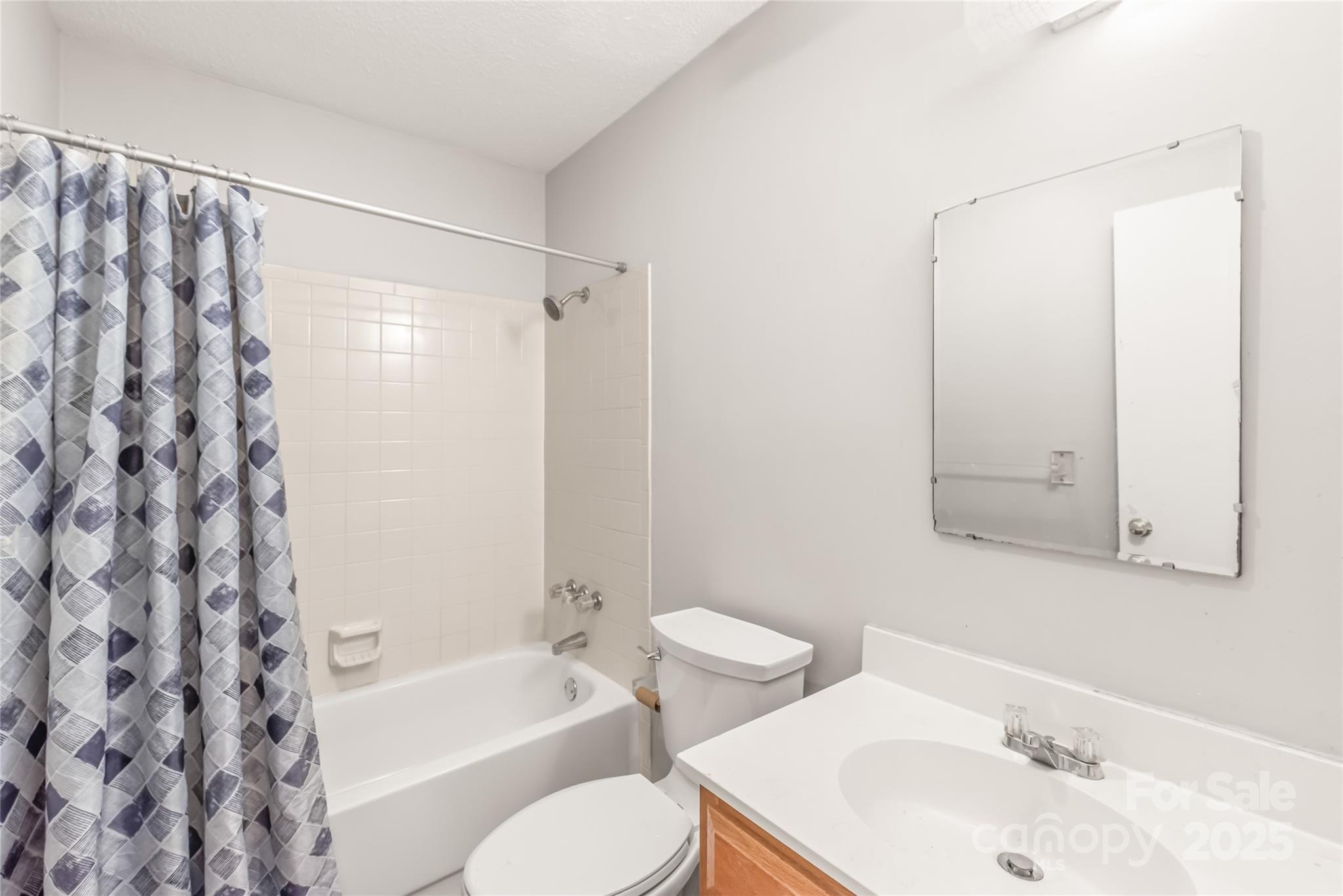 1612 Sharon Road West, Unit 70 Charlotte, NC 28210 - Photo 11 of 18 a bathroom with a sink toilet and shower