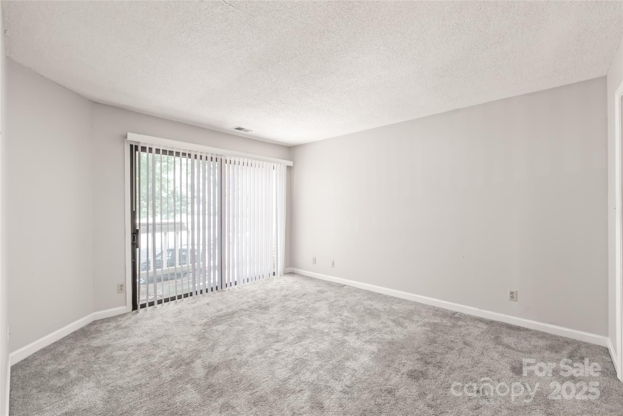 1612 Sharon Road West, Unit 70 Charlotte, NC 28210 - Photo 10 of 18 an empty room with windows