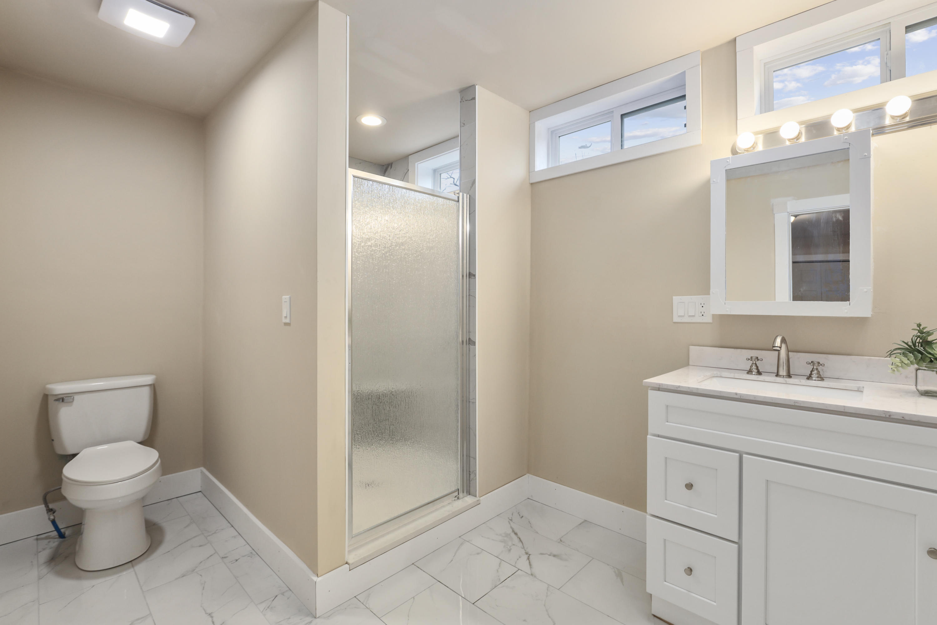 119 Tupper Road Sandwich, MA 02563 - Photo 12 of 32 a bathroom with a toilet sink and shower