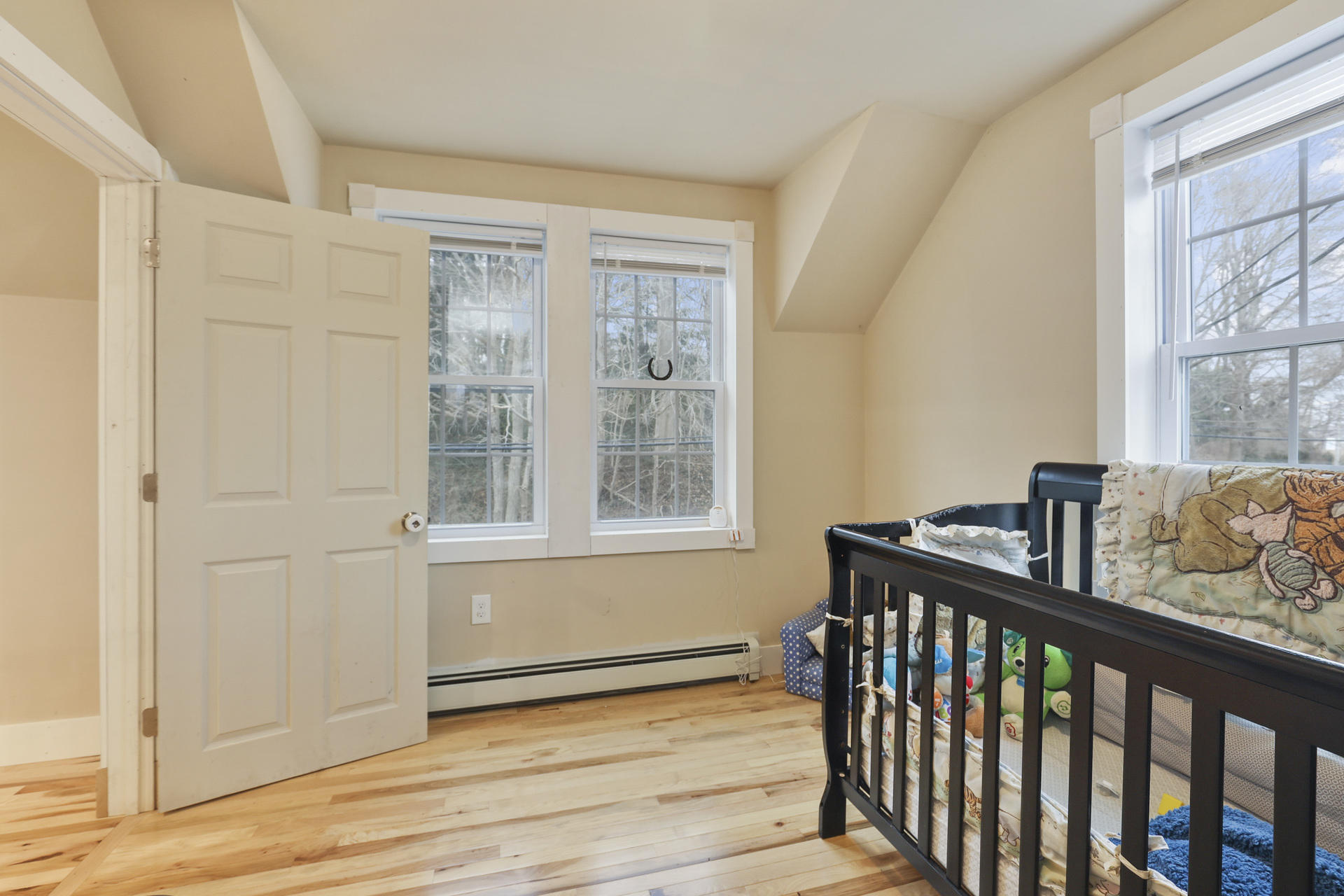 119 Tupper Road Sandwich, MA 02563 - Photo 20 of 32 a view of a room with wooden floor and windows