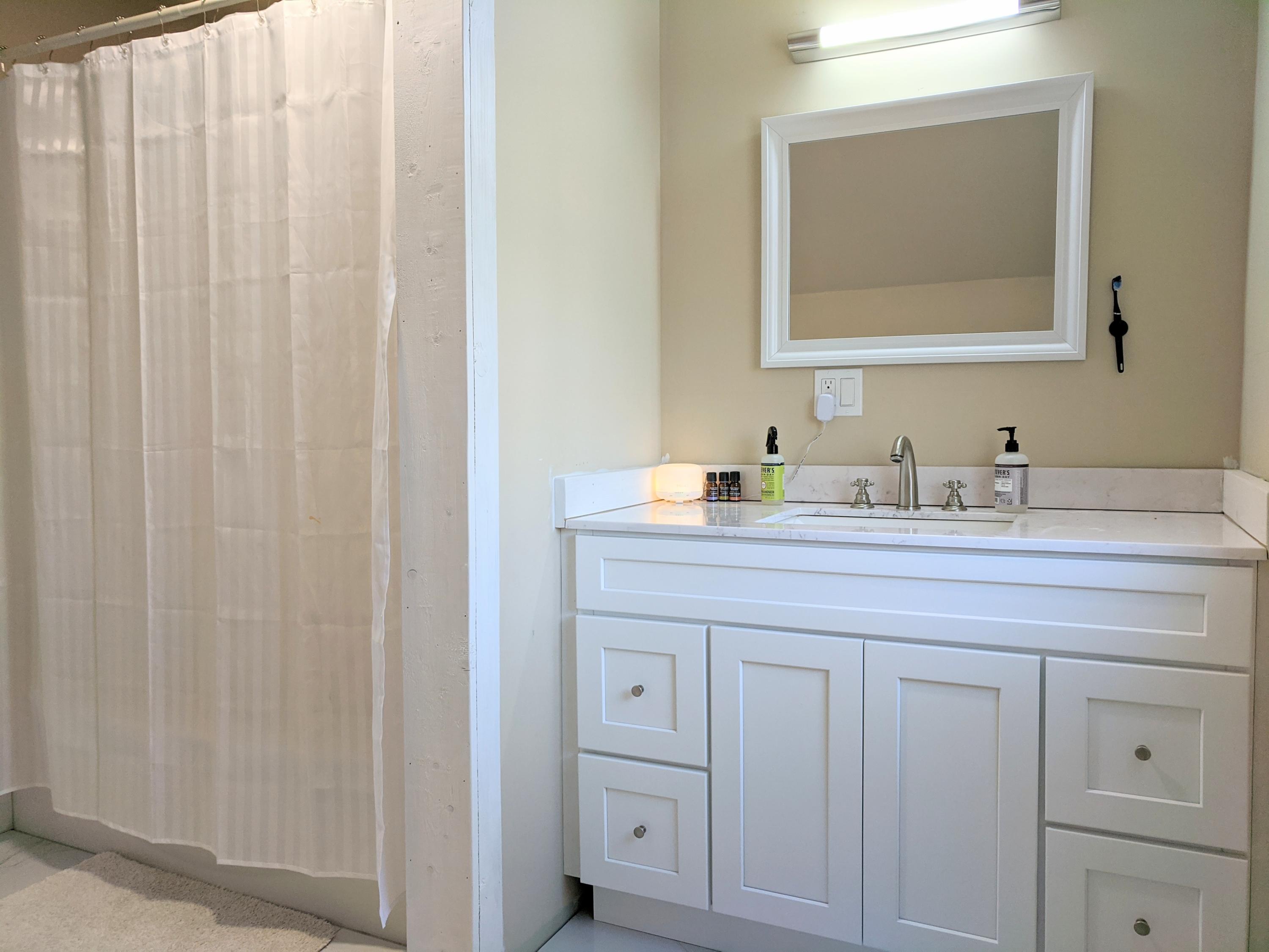 119 Tupper Road Sandwich, MA 02563 - Photo 22 of 32 a bathroom with a sink and a mirror