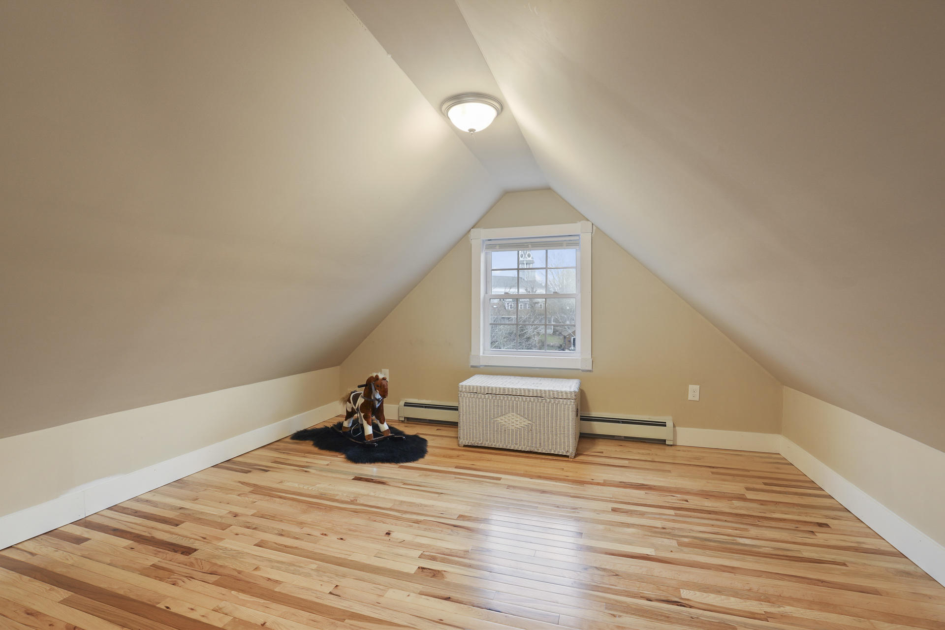 119 Tupper Road Sandwich, MA 02563 - Photo 23 of 32 a view of empty room with wooden floor and fan
