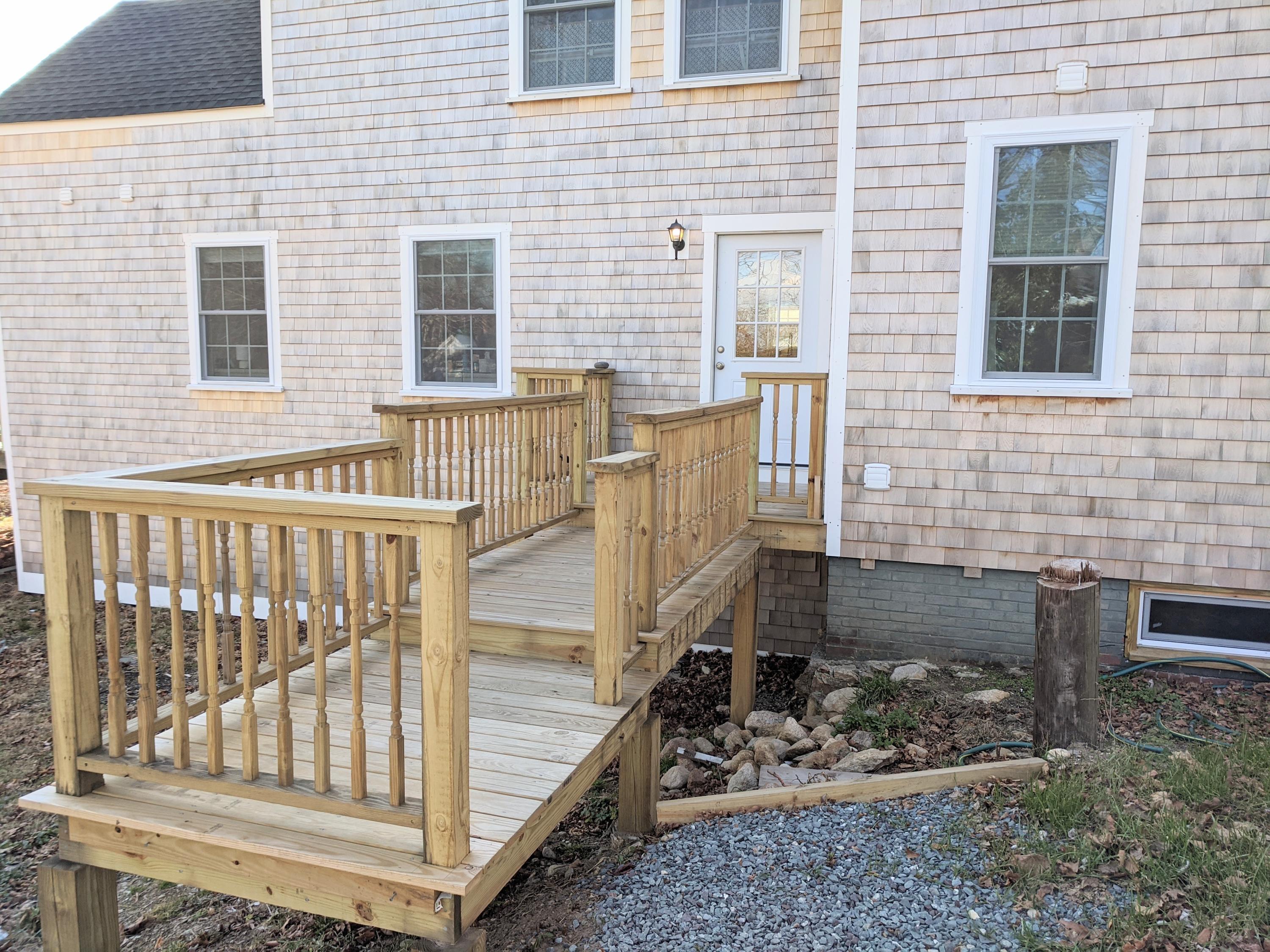119 Tupper Road Sandwich, MA 02563 - Photo 25 of 32 a view of a brick house with a small yard