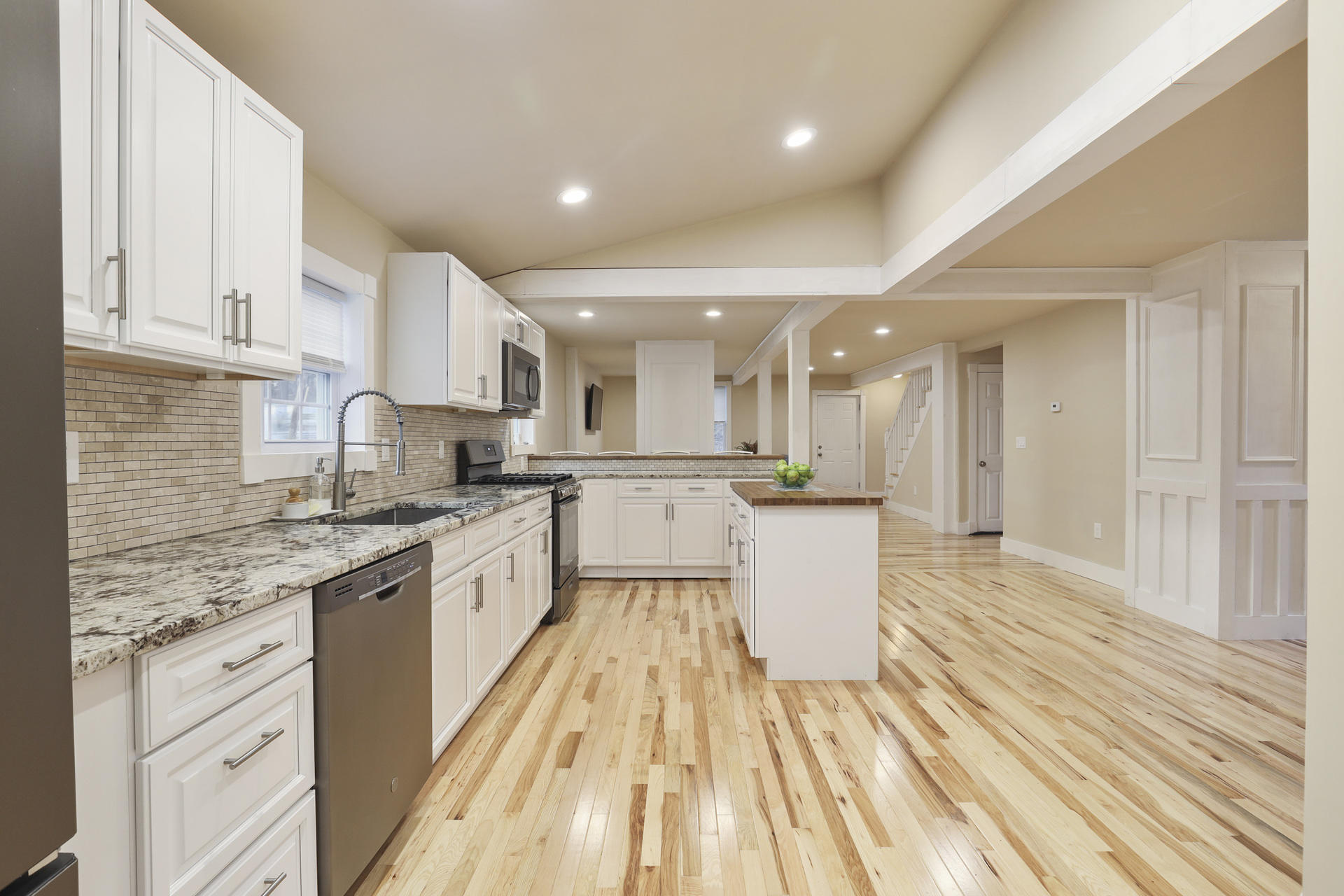 119 Tupper Road Sandwich, MA 02563 - Photo 7 of 32 a large kitchen with kitchen island granite countertop a large counter top space a sink stainless steel appliances and cabinets