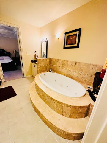 a bathroom with a tub and sink