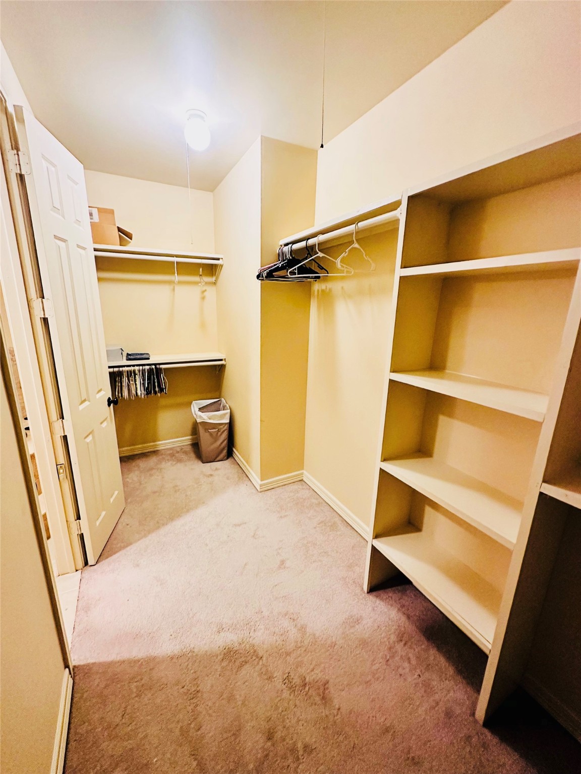 6324 Fairdale Lane, Unit 3007 Houston, TX 77057 - Photo 21 of 24 a view of walk in closet with empty racks