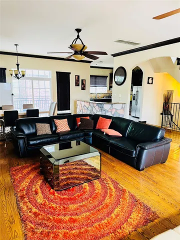 a living room with furniture and flat screen tv