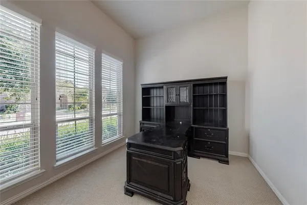 a view of workspace with furniture and window
