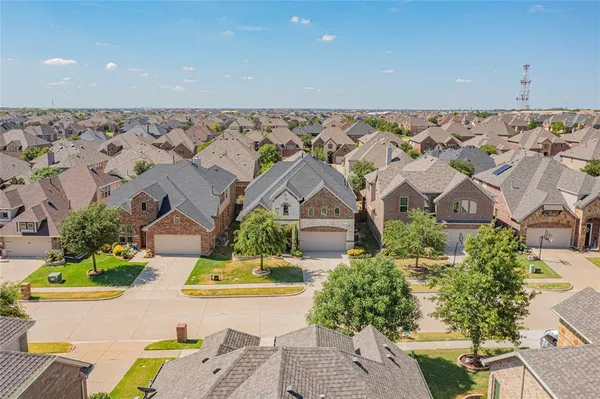 an aerial view of a house with a swimming pool