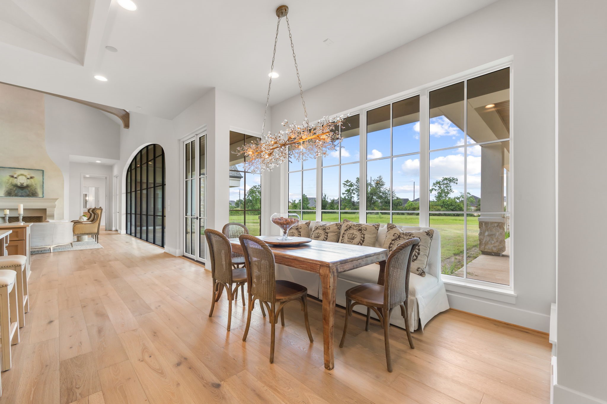 4233 Two Gun Way Katy, TX 77494 - Photo 12 of 47 Large breakfast room/informal dining room with wonderful crystal chandelier and sweeping views of rear loggia and back yard.