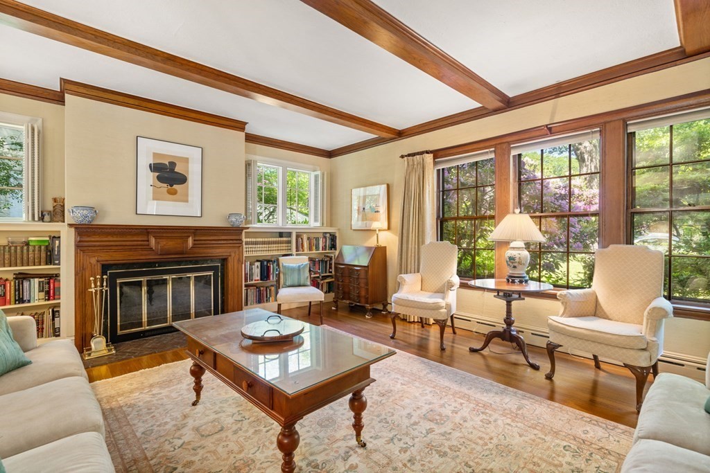 63 Bonad Road Newton, MA 02465 - Photo 2 of 15 a living room with furniture a fireplace and a large window