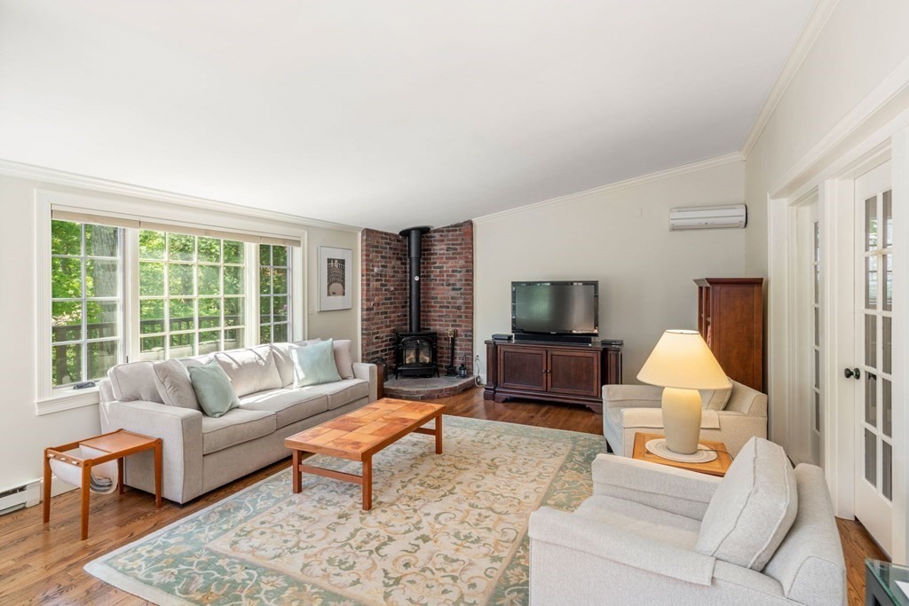 63 Bonad Road Newton, MA 02465 - Photo 6 of 15 a living room with furniture or couch and a fireplace