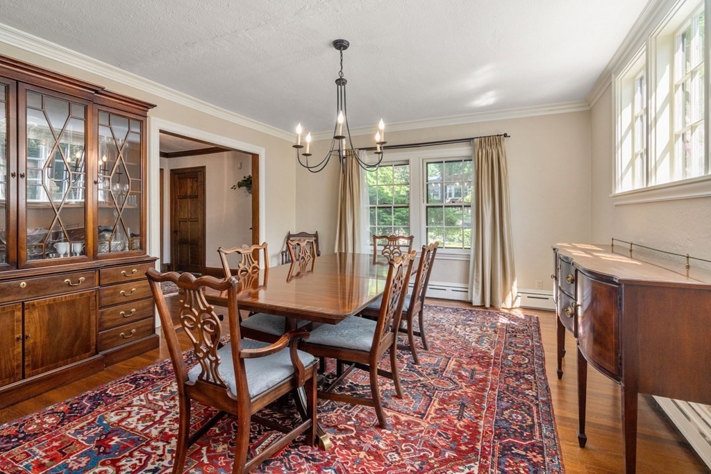 63 Bonad Road Newton, MA 02465 - Photo 8 of 15 a view of a dining room with furniture window and outside view