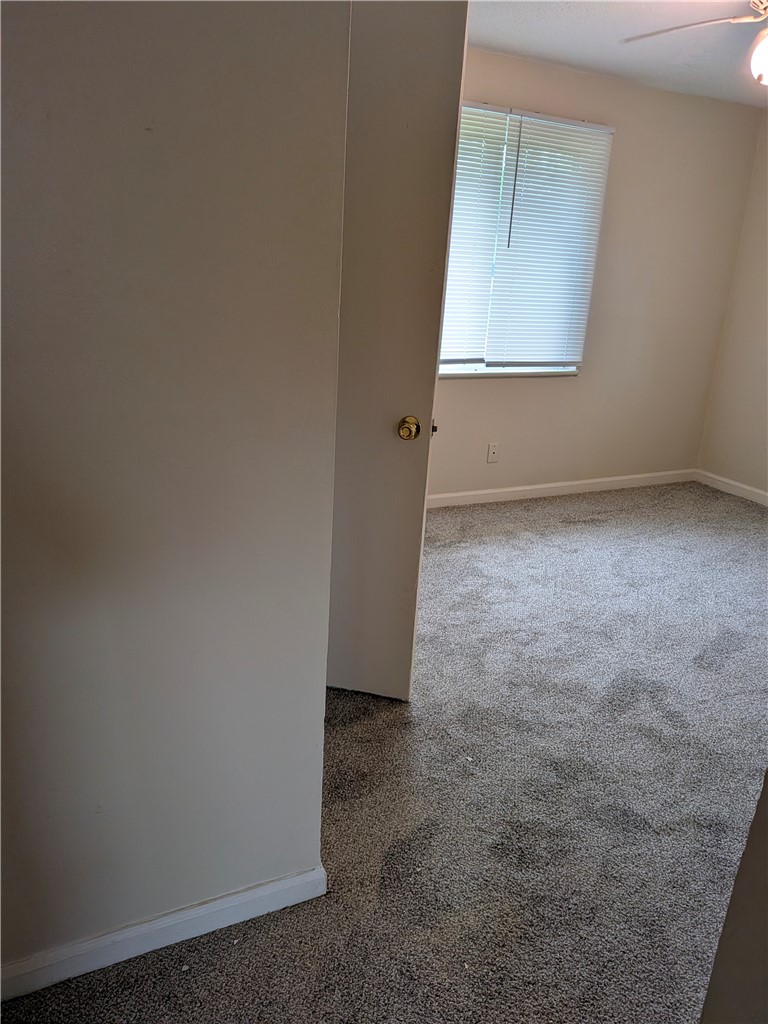 840 Brookfield Road Kettering, OH 45429 - Photo 7 of 13 This spacious bedroom offers ample natural light and a comfortable atmosphere for relaxation.