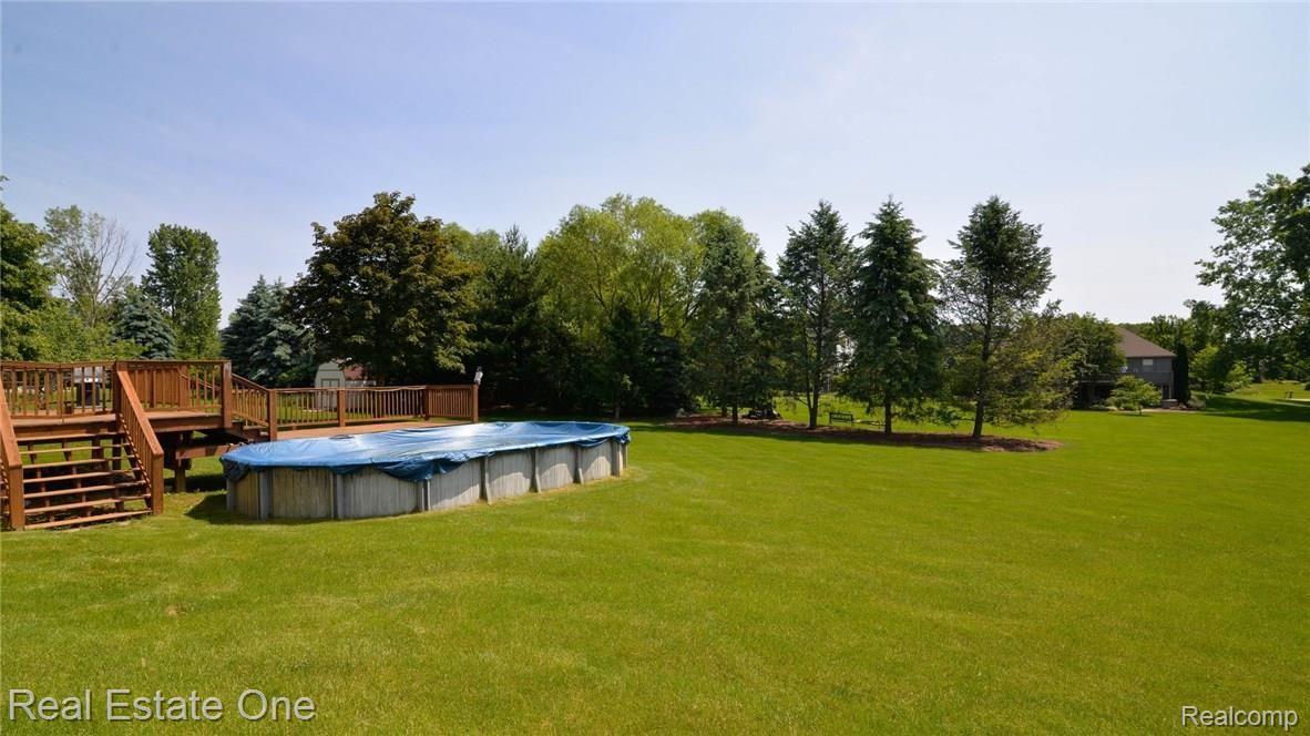 1824 Park Ridge Court Howell, MI 48843 - Photo 40 of 47 2 TIERED DECK WITH ABOVE GROUND POOL.