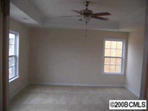79339 Ridgehaven Road Lancaster, SC 29720 - Photo 8 of 8 an empty room with windows and fan