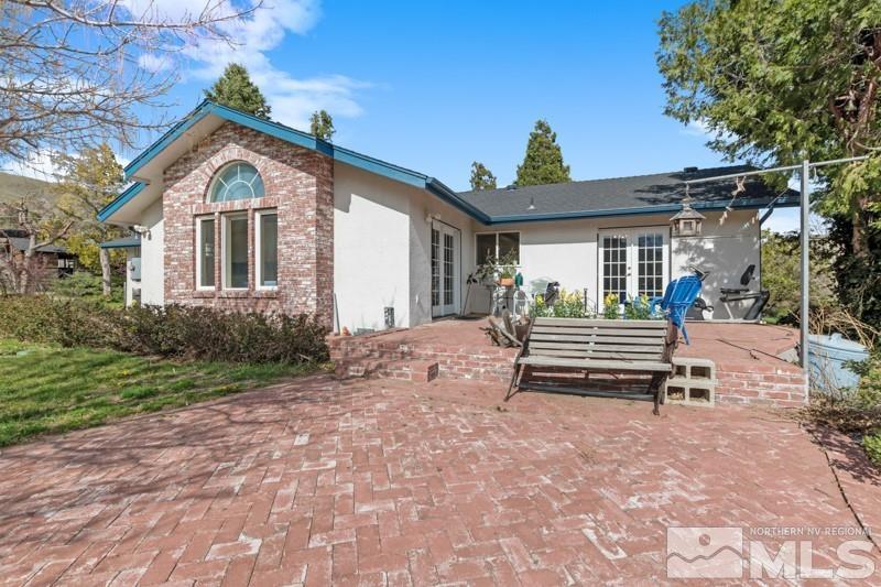 21025 Ames Lane Reno, NV 89521 - Photo 2 of 34 a view of a house with a yard