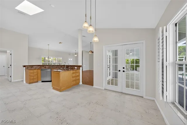 a view of a kitchen with a sink and dishwasher cabinet