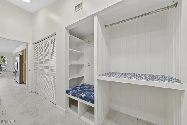 a view of room with cabinets