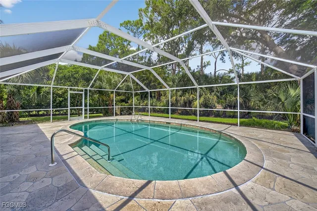 a view of a wooden deck with a swimming pool