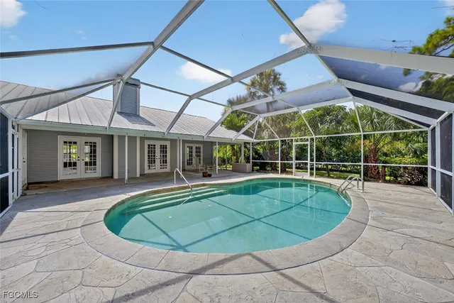 a view of a swimming pool with a patio
