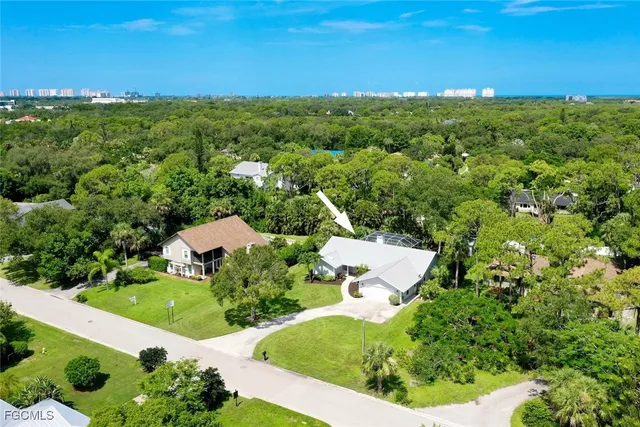 a view of a garden with a building in the background