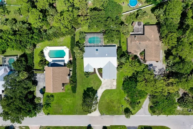 an aerial view of a house with a yard and garden