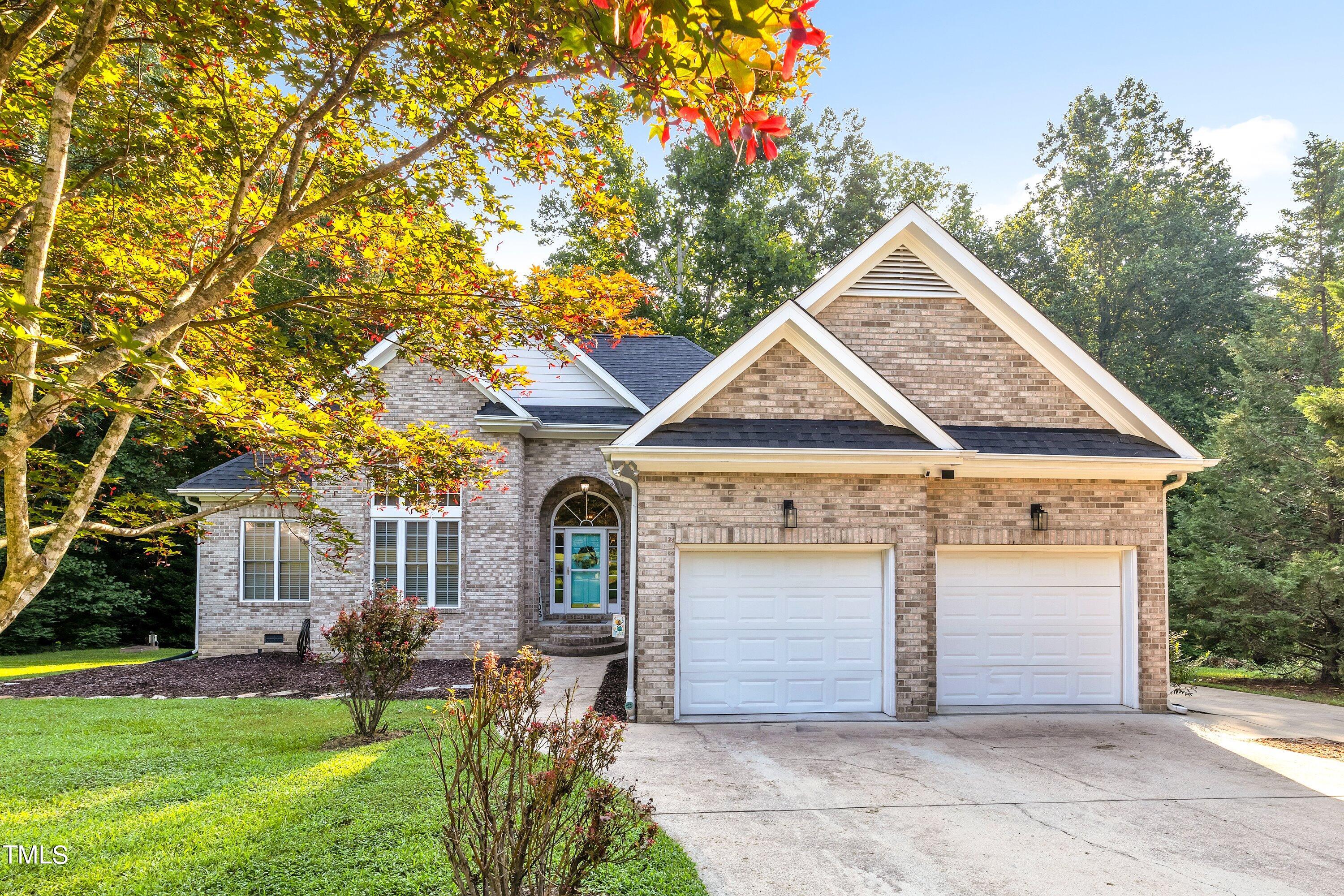 4617 Cherrybark Lane Raleigh, NC 27616 - Photo 1 of 53 a front view of a house with garden