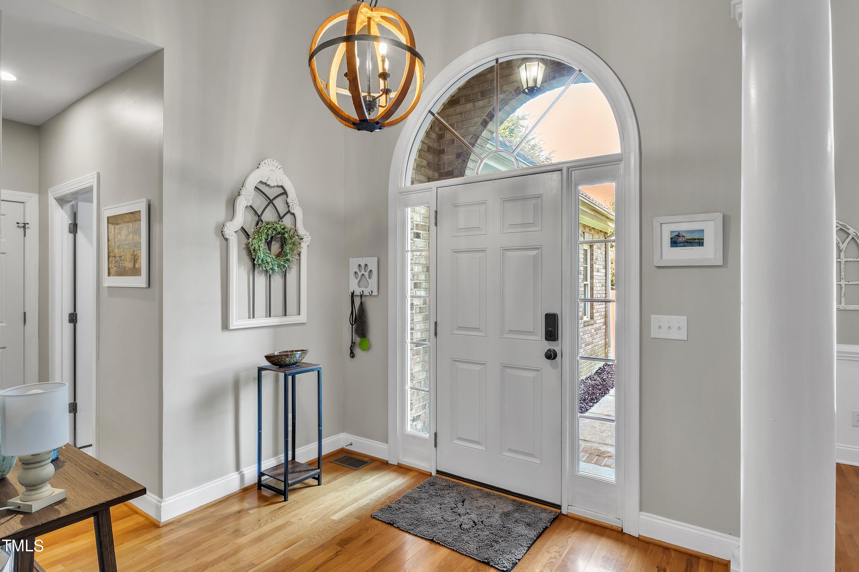 4617 Cherrybark Lane Raleigh, NC 27616 - Photo 11 of 53 a view of an entryway with wooden floor