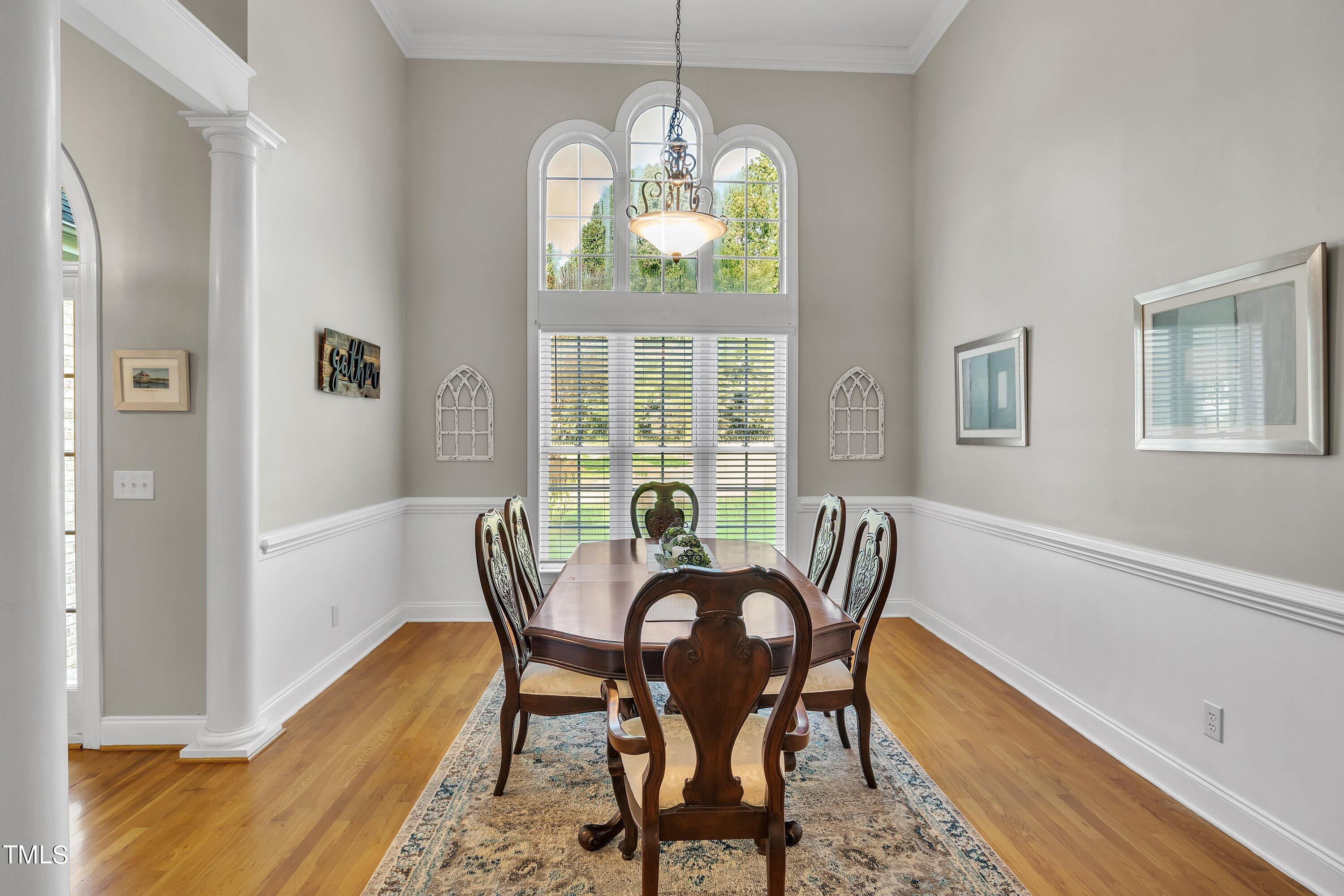 4617 Cherrybark Lane Raleigh, NC 27616 - Photo 14 of 53 a view of a dining room with furniture window and wooden floor