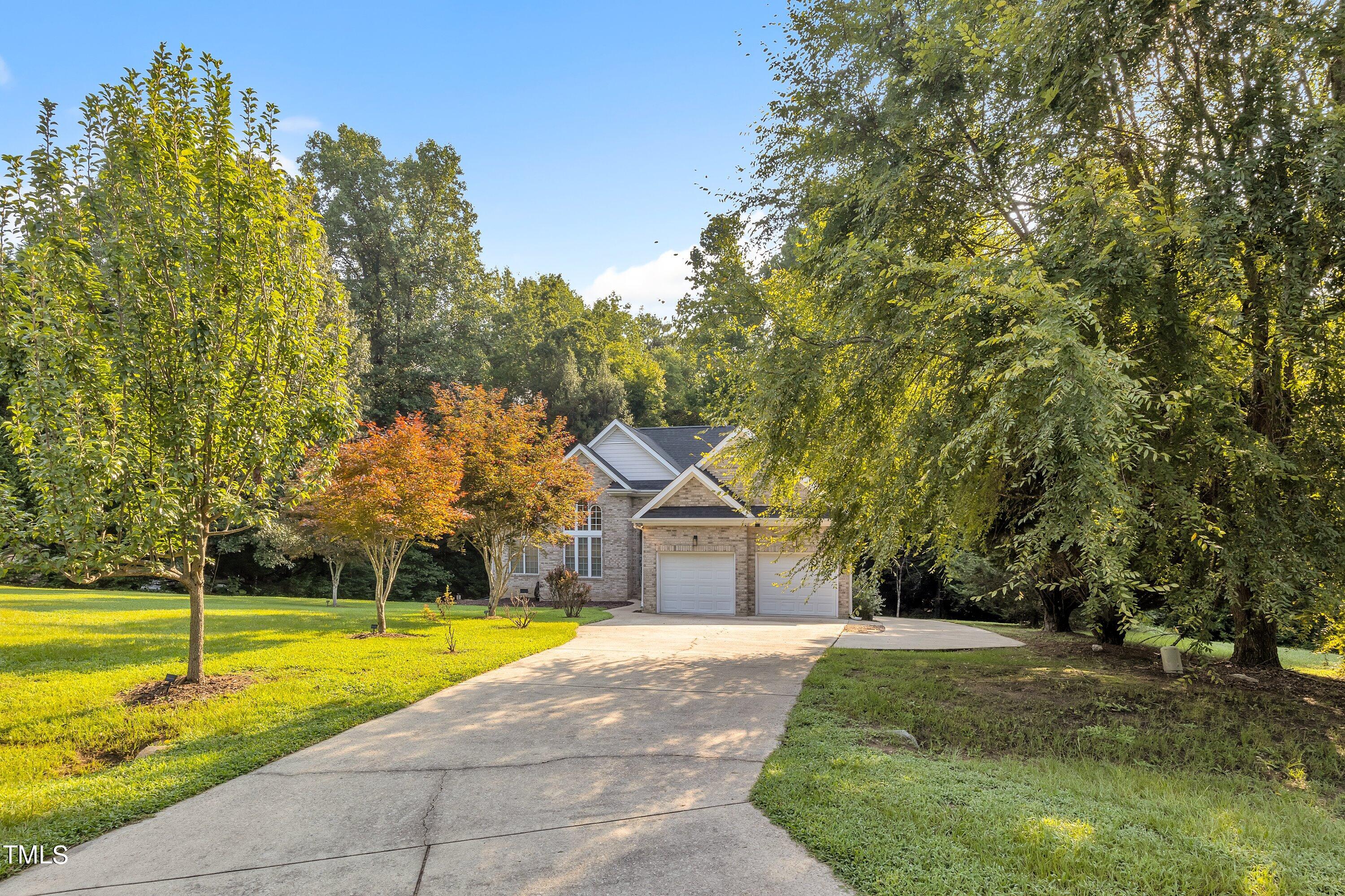 4617 Cherrybark Lane Raleigh, NC 27616 - Photo 2 of 53 a front view of a house with a yard