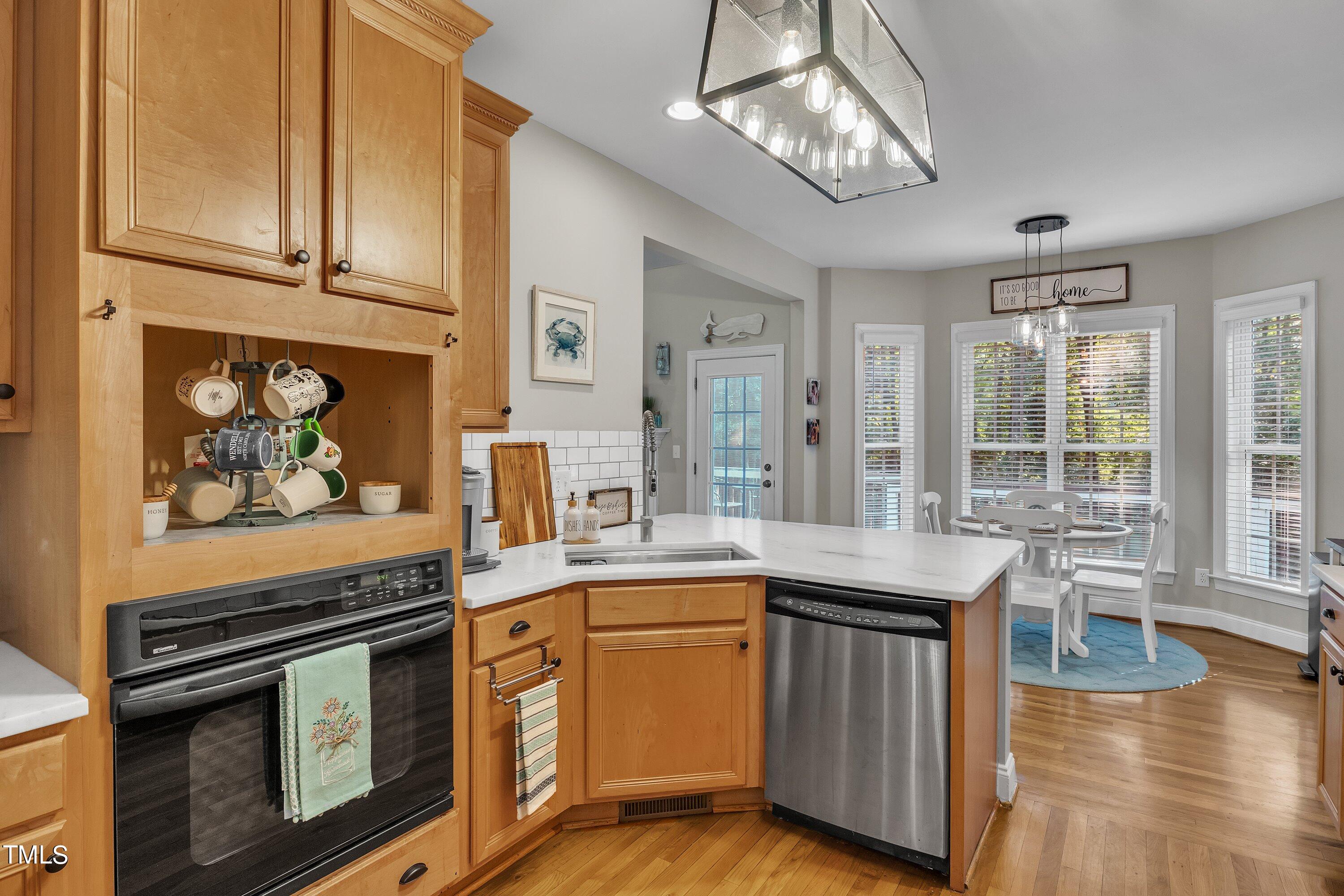 4617 Cherrybark Lane Raleigh, NC 27616 - Photo 28 of 53 a kitchen with stainless steel appliances granite countertop a stove and cabinets