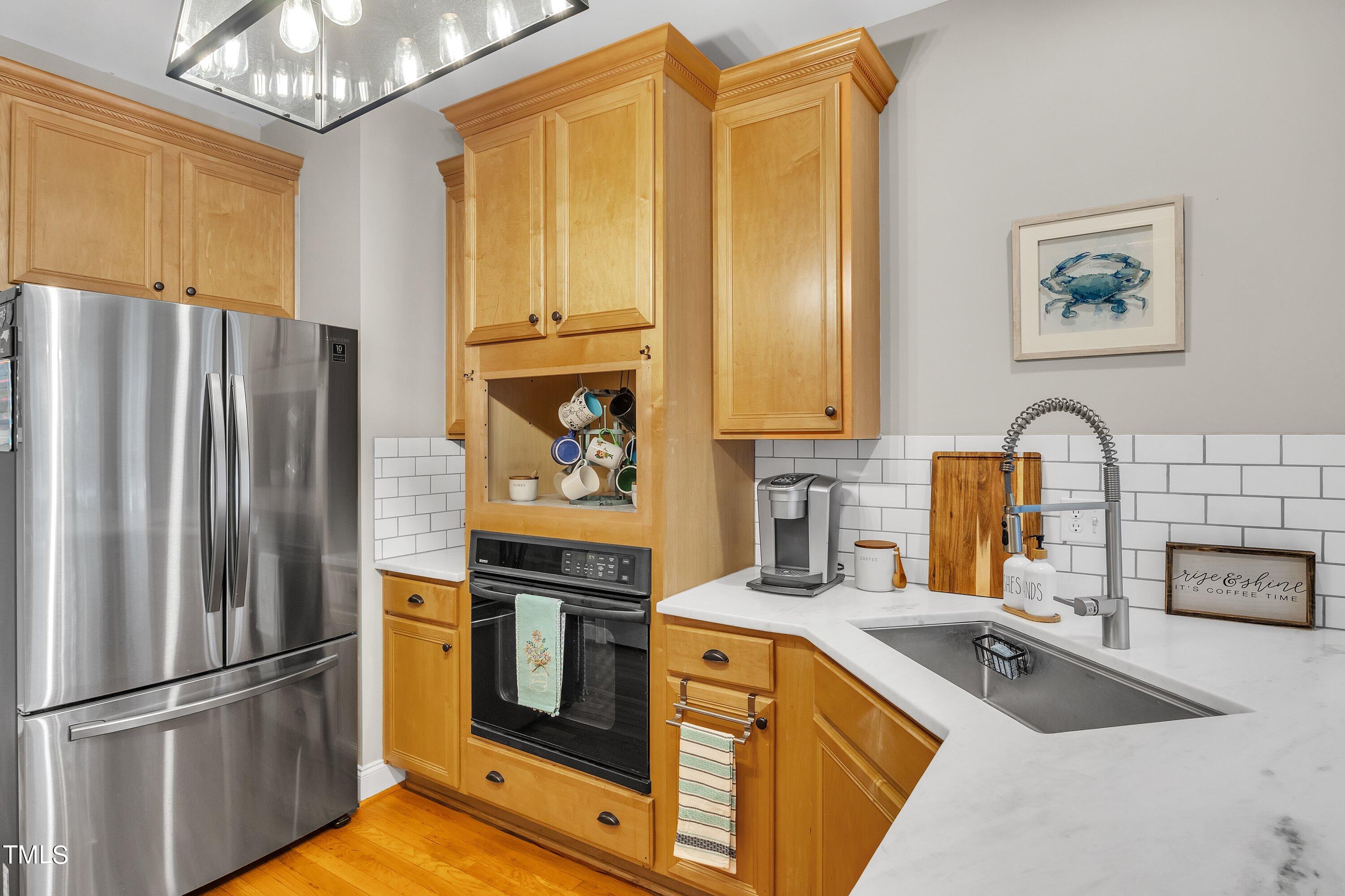 4617 Cherrybark Lane Raleigh, NC 27616 - Photo 29 of 53 a kitchen with stainless steel appliances granite countertop a refrigerator and a sink