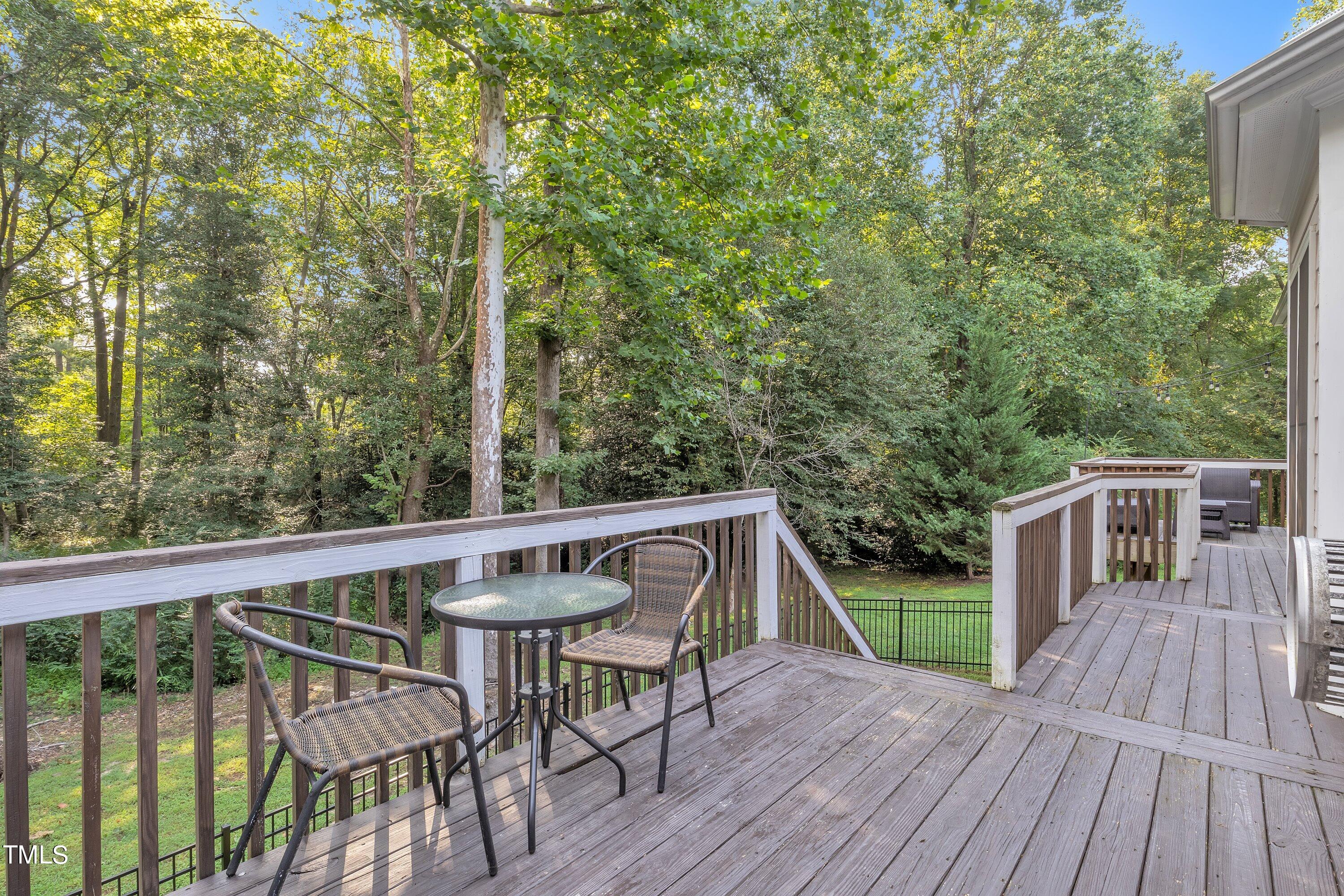 4617 Cherrybark Lane Raleigh, NC 27616 - Photo 49 of 53 a view of a deck with wooden floor and fence with a large garden