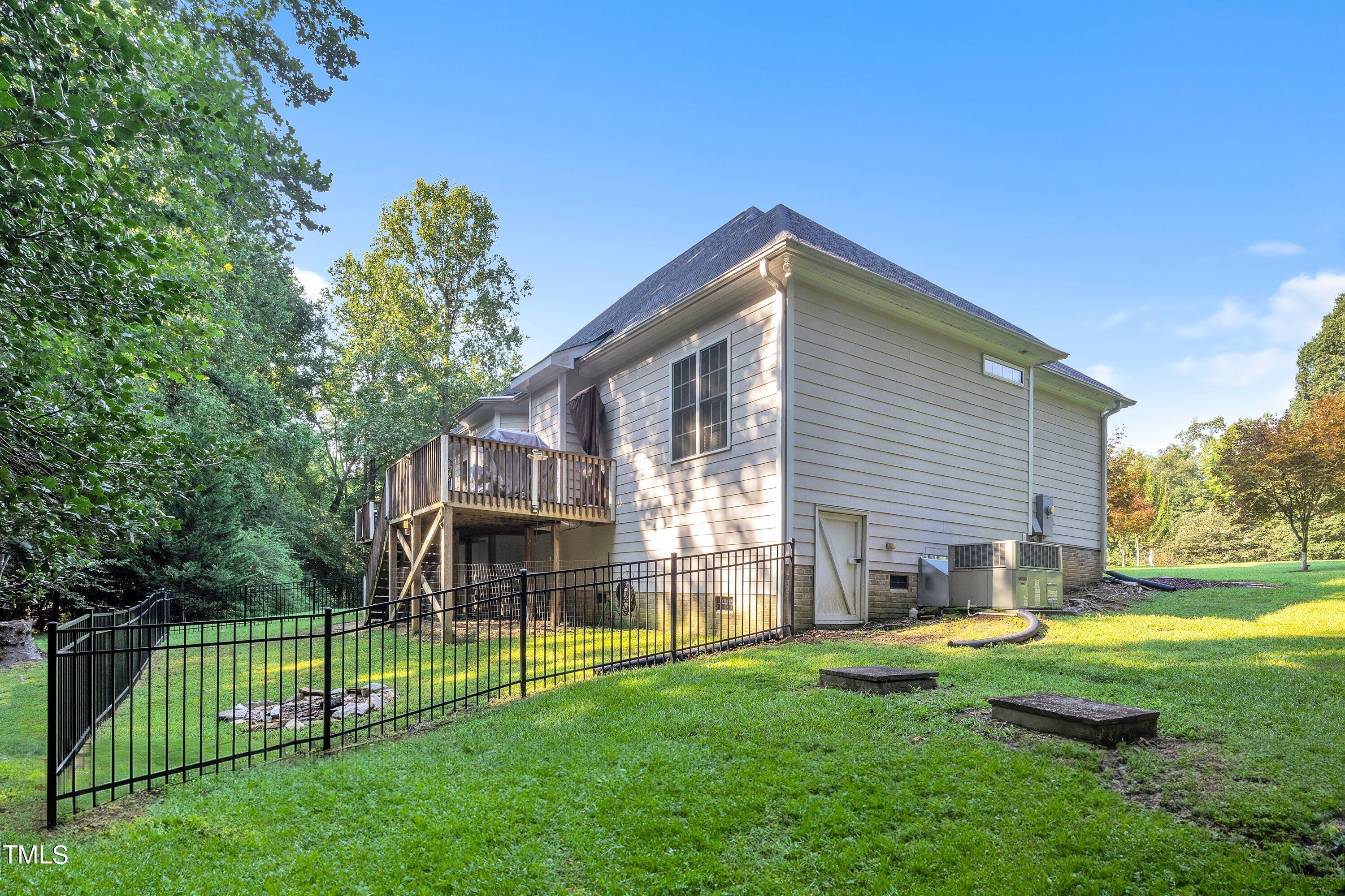 4617 Cherrybark Lane Raleigh, NC 27616 - Photo 53 of 53 a view of a house with a yard and a patio