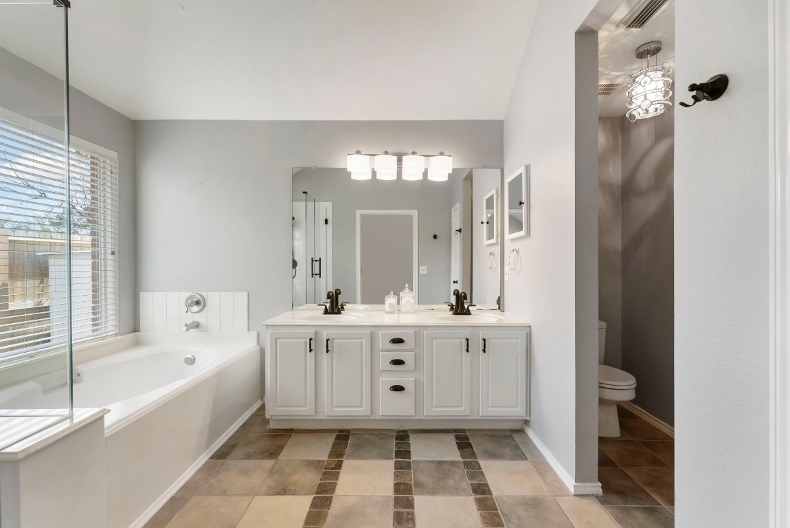 2015 Louetta Brook Court Spring, TX 77388 - Photo 14 of 28 a spacious bathroom with a tub sink and mirror