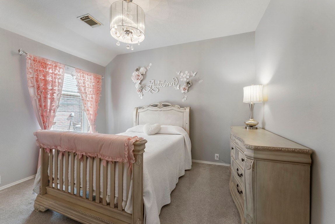 2015 Louetta Brook Court Spring, TX 77388 - Photo 18 of 28 a bedroom with a bed and a window