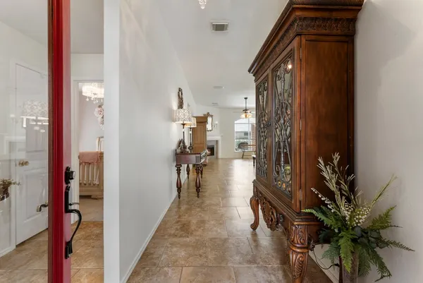 a hallway with view of living room