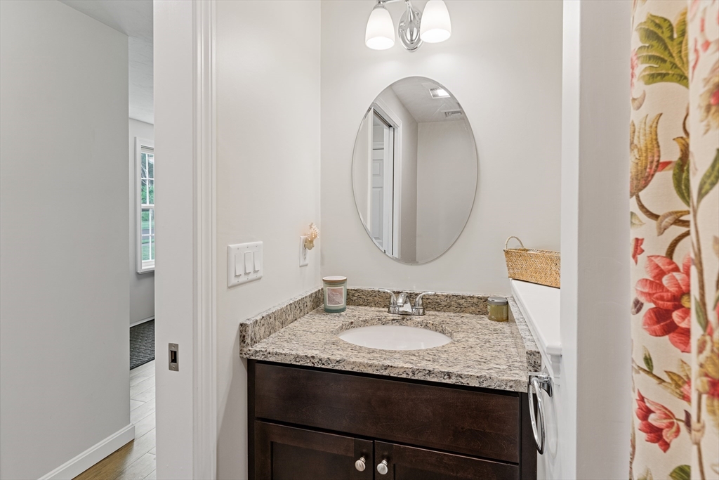 9 Tupper Hill Road, Unit 9 Plymouth, MA 02360 - Photo 15 of 30 a bathroom with a granite countertop sink and a mirror