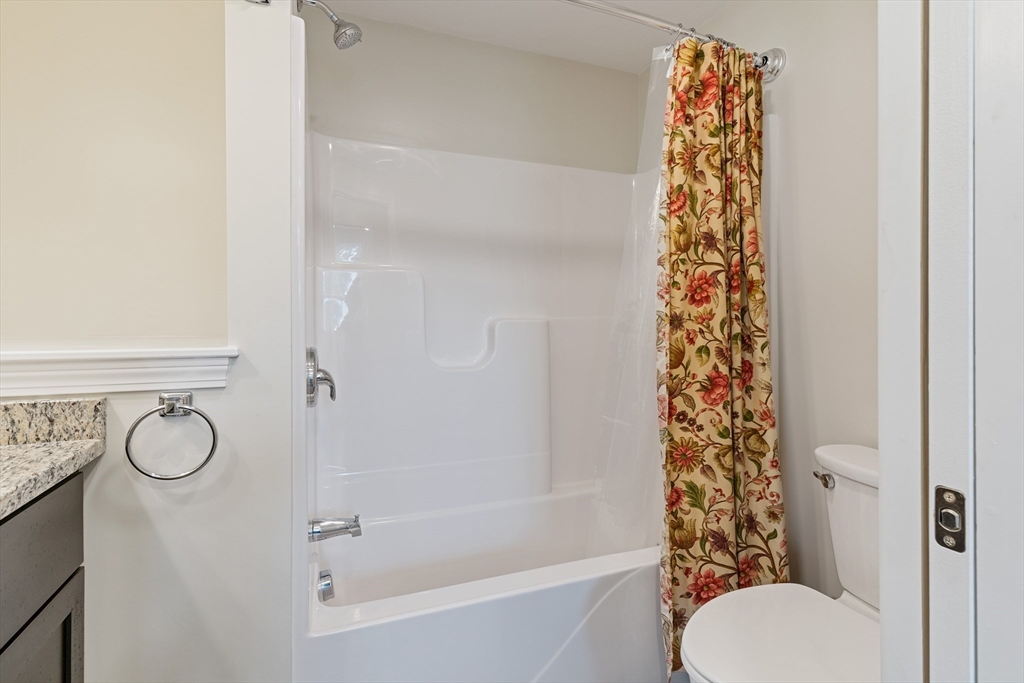 9 Tupper Hill Road, Unit 9 Plymouth, MA 02360 - Photo 17 of 30 a bathroom with a shower curtain and a window