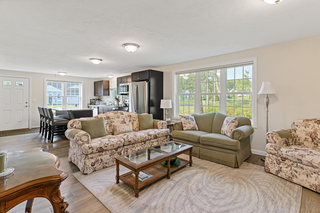 9 Tupper Hill Road, Unit 9 Plymouth, MA 02360 - Photo 20 of 30 a living room with furniture and a large window