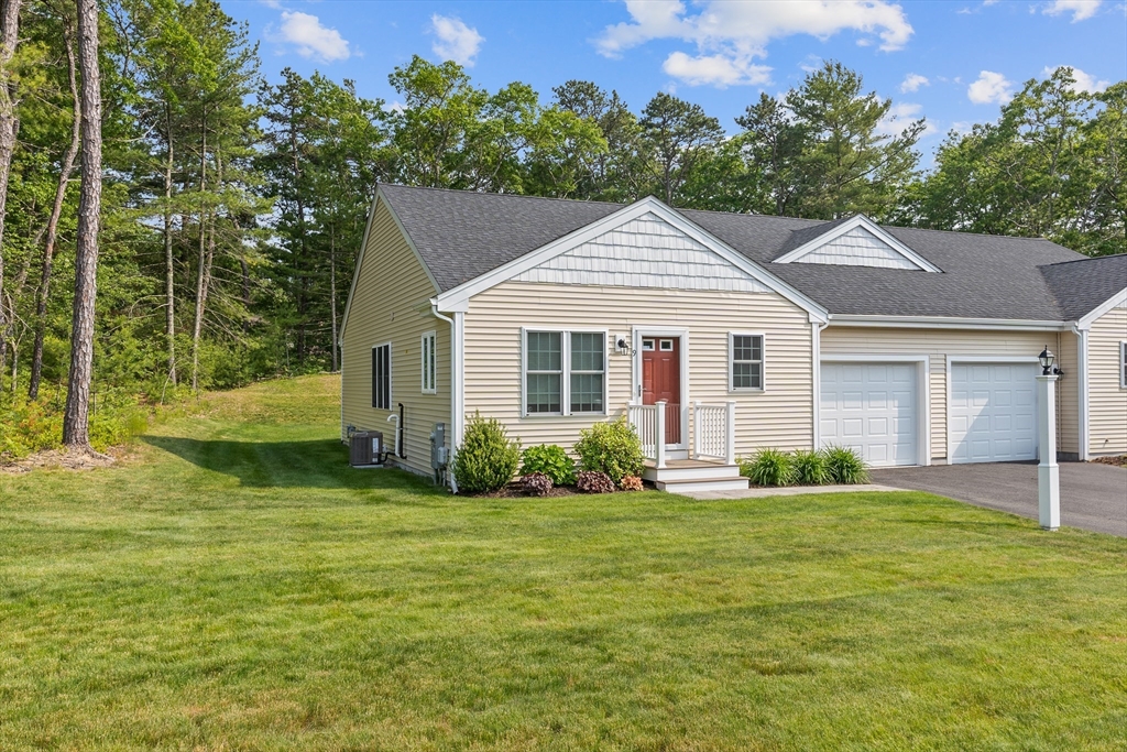 9 Tupper Hill Road, Unit 9 Plymouth, MA 02360 - Photo 2 of 30 a front view of a house with a yard