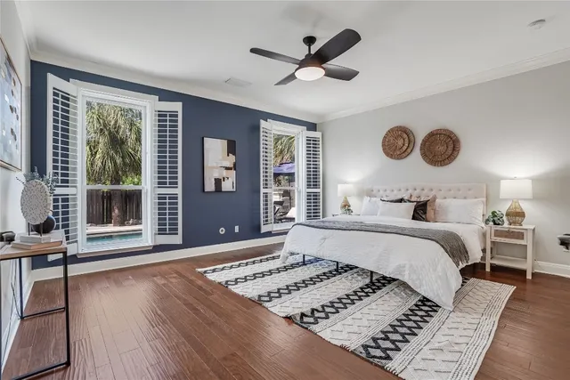 a bedroom with a large bed and a window