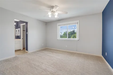 a view of a patio with table and chairs with wooden fence and plants