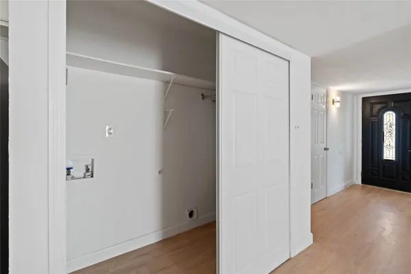 a view of a room with wooden floor