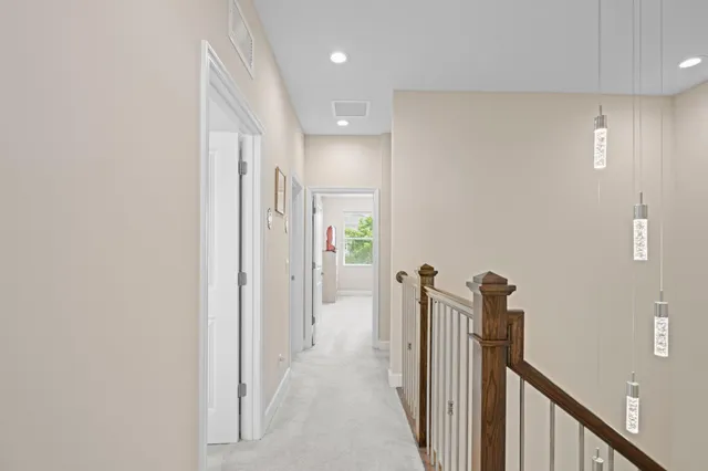 a view of a hallway with a room