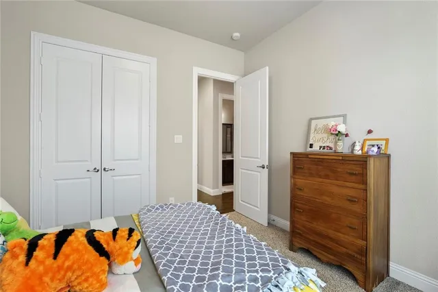 a bedroom with a bed and a cabinets