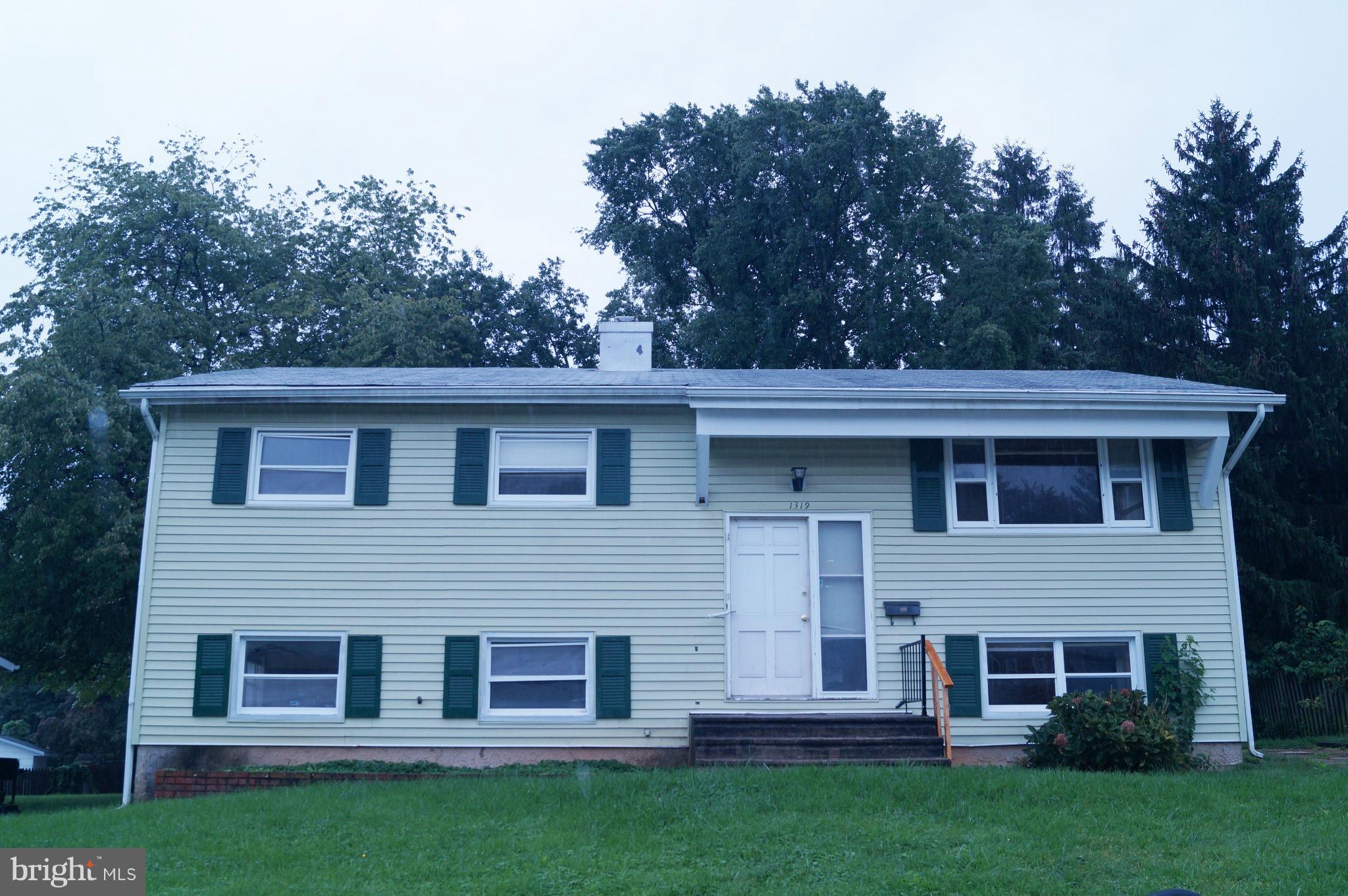 1319 Denbright Road Baltimore, MD 21228 - Photo 1 of 11 a view of a house with a yard